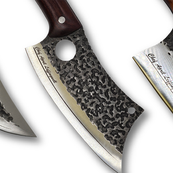 Close-up of a knife with an engraved  textured blade and wooden handle on a white background