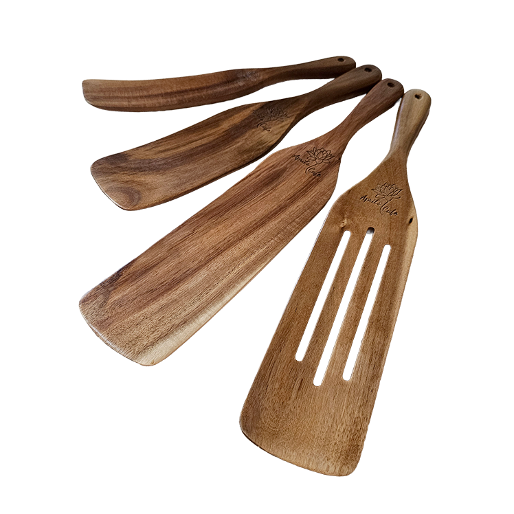 Set of engraved wooden spatulas on a white background